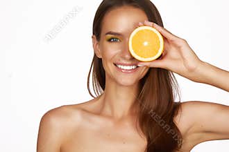 Beautiful brunette woman with citrus on a white background, healthy food, tasty food, organic diet, smile healthy