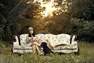 Women in twenties fashion on vintage couch