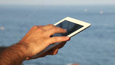 Browsing tablet Next to the Seashore Panoramic