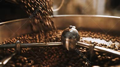 A commercial coffee roasting machine in action