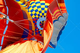 Vibrant Hot Air Balloon Interior with a Checkerboard Pattern of Red, Blue, and Yellow, Radiating Outwards
