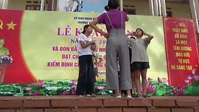 Vietnamese schoolgirls are practicing performing arts to prepare for the opening day of the new school year