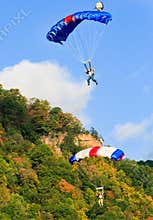 Two Colorful Skydiving Base Jumpers