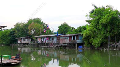 Life village houses along Prem Prachakon canal river Bangkok Thailand