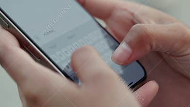 Crop view of woman hands write message to boyfriend via smartphone outdoor