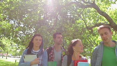 Cheerful students walking outside