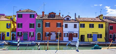 Colorful street with canal in Burano