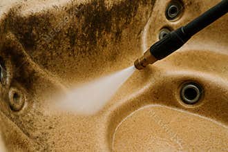 Power Washing a Fiberglass Hot Tub to Remove Dirt and Grime