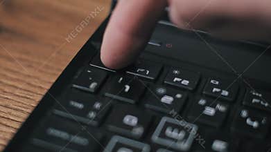Finger Pressing ESC Key On Laptop Keyboard