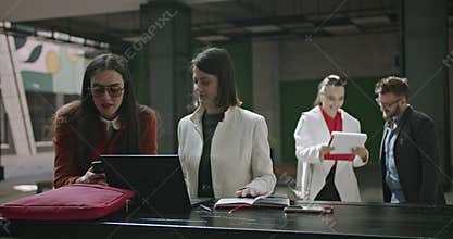 Business Colleagues Collaborate in a Modern Office, Discussing Project Strategies and Achieving Productivity Through Teamwork.