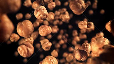 Chickpeas fly and fall. Filmed on a high-speed camera at 1000 fps.