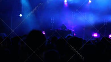 Huge crowd dancing at a DJ show, with great lightning effects. Barcelona