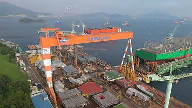 Massive Shipbuilding: Samsung Heavy Industries Shipyard with Cranes and Dry Docks