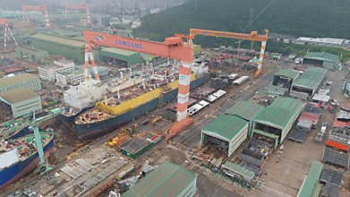Aerial View of Massive Samsung Heavy Industries Shipyard with Ships Under Construction