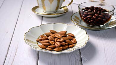 Coffee Beans and Almonds on Elegant Dishware