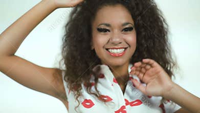 Pretty african american teenage smiling on white background