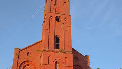Historic Church Imagery, Heritage Building With Mossy Bricks And Detailed Bell Tower Under Sunny Sky. Media