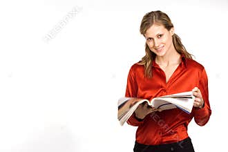 Attractive young woman reading magazine
