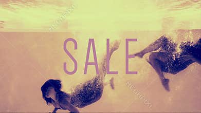 Two girls diving into swimming pool in evening dresses with sale text