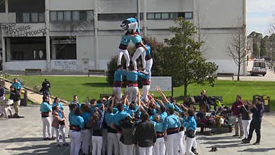 SPAIN - ERANDIO - 4 DE ABRIL DE 2022: Castellers building human towers step by step in a traditional performance