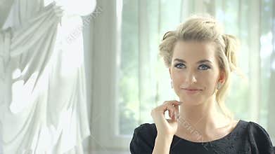 Footage of attractive blonde woman waiting at the restaurant table for her date