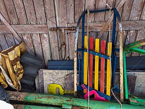 A pile of old tools sitting on top of a wooden wall
