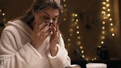 Woman apply nose strip for beauty, pores and blackhead. skincare product for skin cleansing