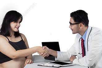 Pregnant woman getting congratulation