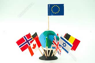 Flags of different countries arranged around a small globe with a European Union flag at the top
