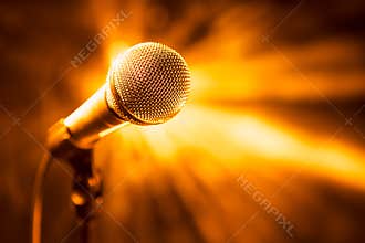 Golden microphone on stage