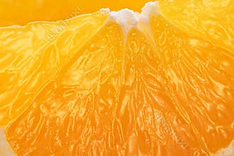 Orange fruit juicy carpels or orange flesh close up. Macro shot of orange flesh structure