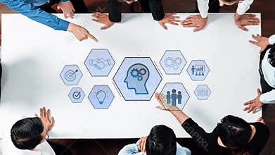 Business Team Collaborating on Innovative Solutions with Digital Mind Graphic, Highlighting Creativity and Strategy in