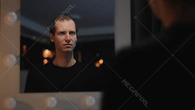 Contemplative Reflection in a Mirror Exploring the interplay of candid moments and artistic beauty