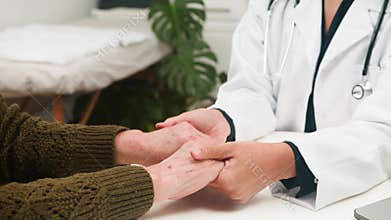 A Compassionate Doctor Comforts an Elderly Patient During a Medical Consultation, Offering Support and Empathy
