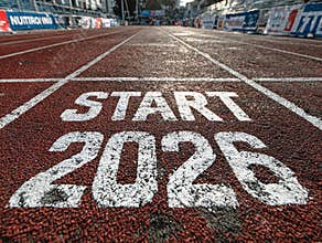 Empty start line for a New Years Day running event, 2026, on a well-maintained red track with white START letters and lane