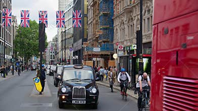 London, England - May 12, 2025: Classic red double-decker bu