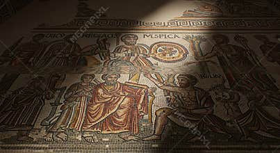 Ancient Byzantine Mosaic Art in a Darkened Church with a Beam of Light