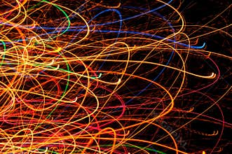 Abstract Bright Multicolored Glowing Lines and Curves on Black Background