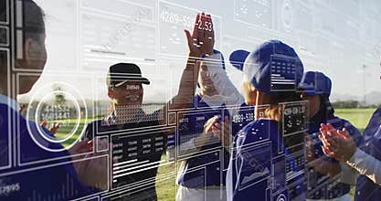 High-fiving and clapping baseball players wearing jerseys on grassy field with data overlay
