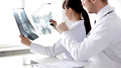 Two doctors with x-ray prints