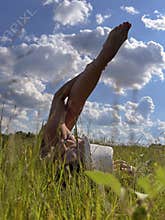 a mature woman with long blonde hair is relaxing in nature