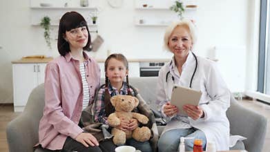 Doctor Checking Child's Temperature