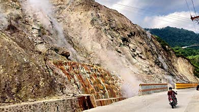 geothermal hot springs steam emissions with hydrogen sulfide in the mountains of the Philippines Asia