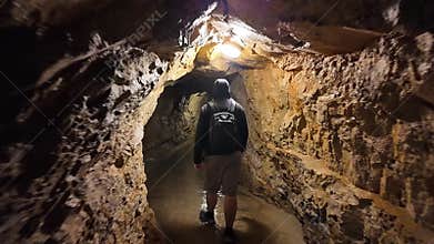 Tourists circulating through the passages of the impressive caves of Postojna, Slovenia.