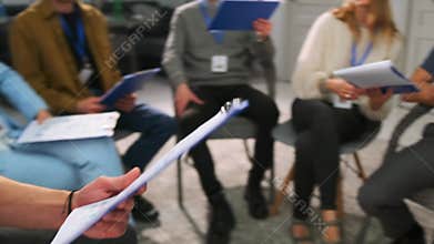 Participants discussing tasks during personal growth training