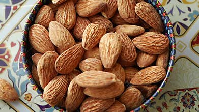 Almonds in a colorful bowl on a decorative table