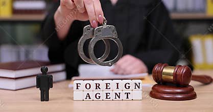 Tense courtroom scene highlighting foreign agent accusations and the gravity of justice