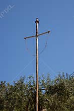 Rusted high metal cross in the nature, Greece