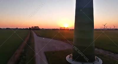 Wind Turbines at Sunrise Aerial Fly-Through 8K