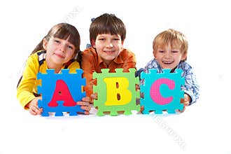 Children with Alphabet Puzzle